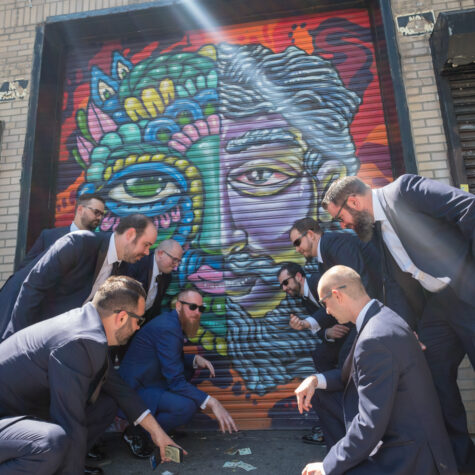 Groomsmen nyc playing dice in graffiti alley