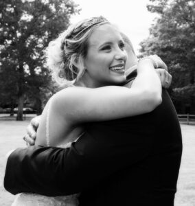 Bride crying tears with dad