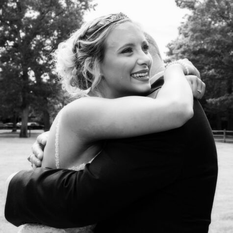 Bride crying tears with dad