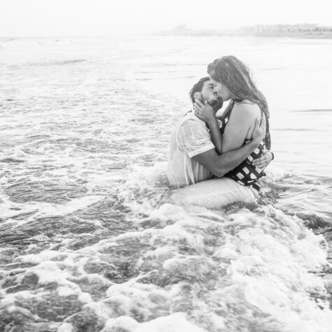 Couple kiss in ocean beach