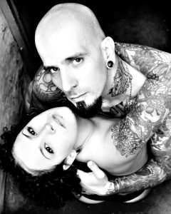 tattooed couple boudoir embracing