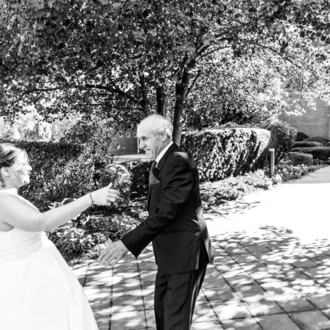 Bride hugging grandfather at church candid moment