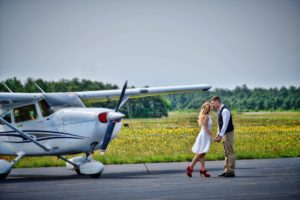 engagemnet-couple-airplane-portrait