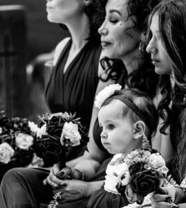 Flower girl with bridesmaids black and white in church