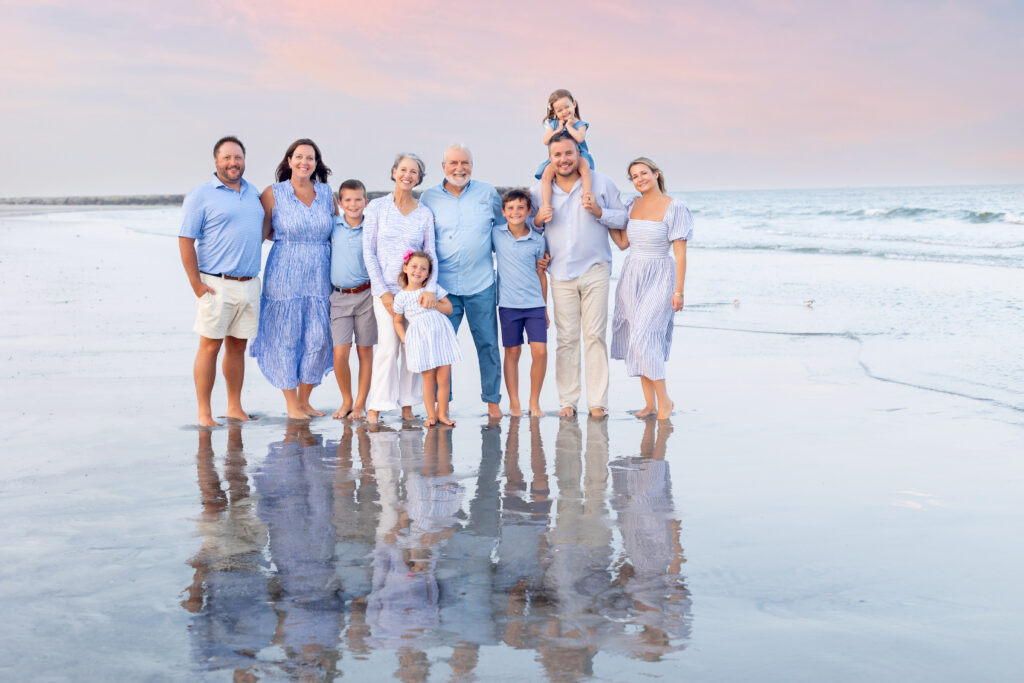 Family portrait on beach with reflection