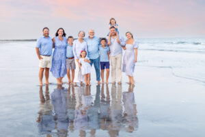 Family portrait on beach with reflection