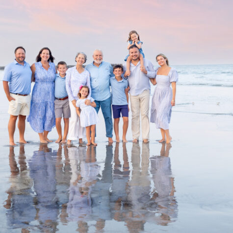 Family portrait on beach with reflection