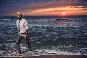 Sunrise walking in ocean fully clothed