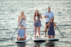 Family on SUP paddle board portrait
