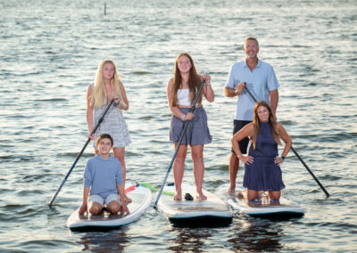 Family on SUP paddle board portrait
