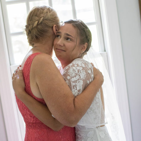 Bride and mom hug