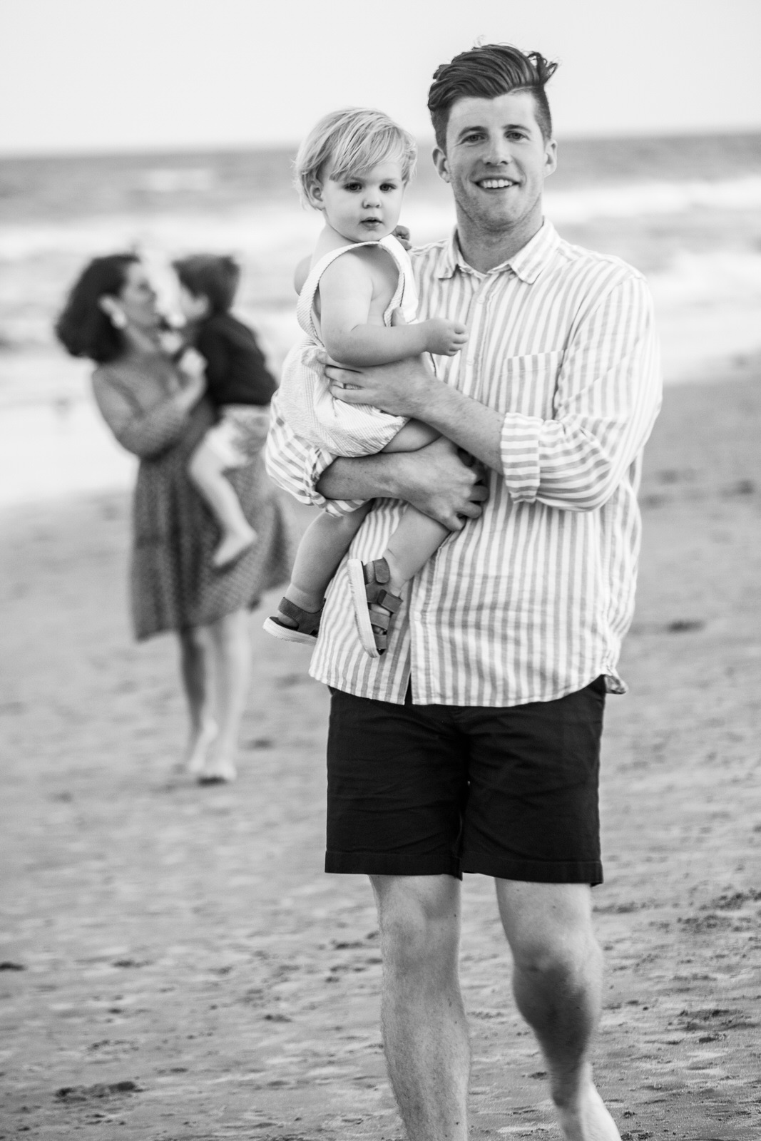 black and white family beach