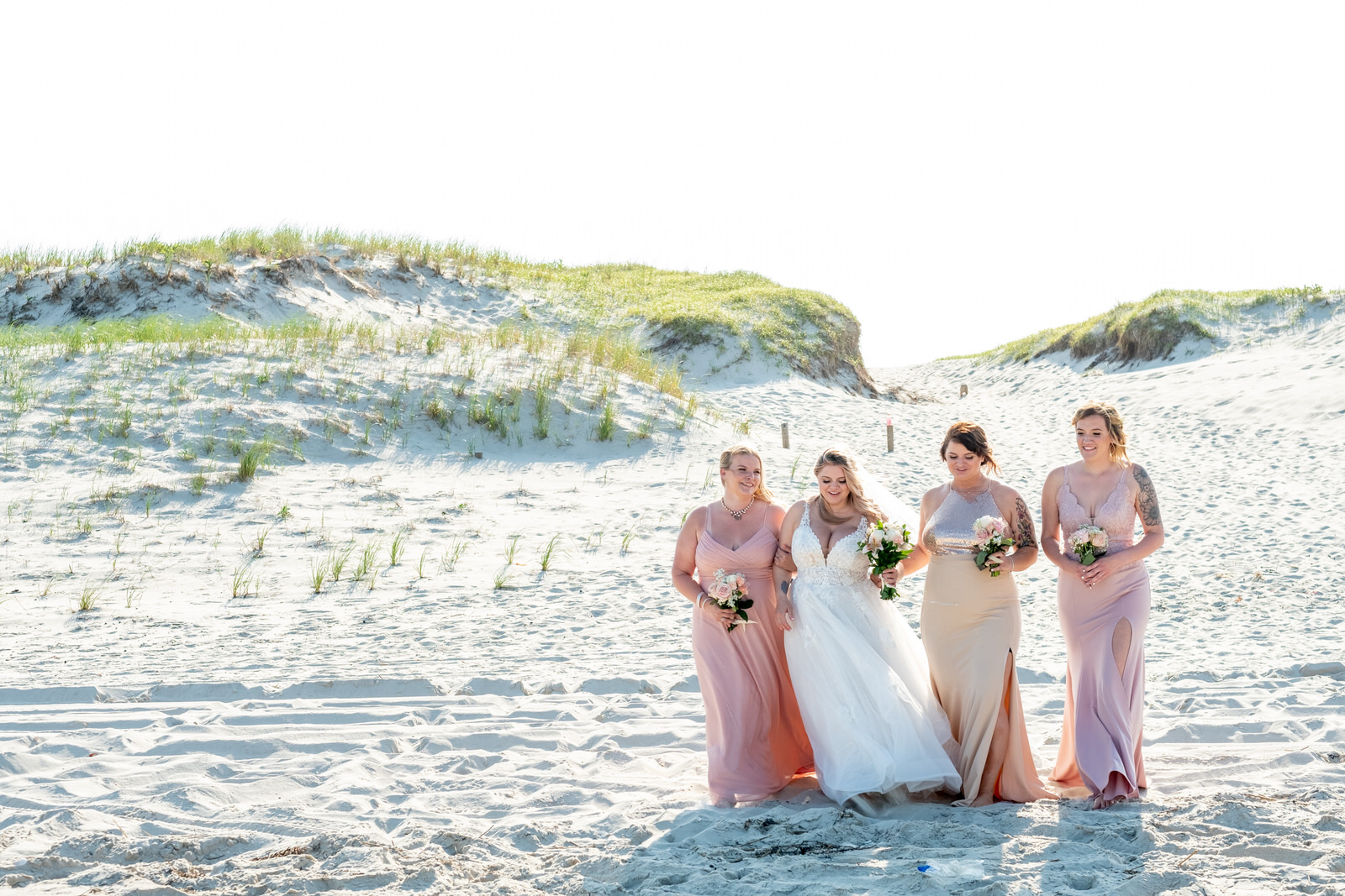 bridesmaids walking beach