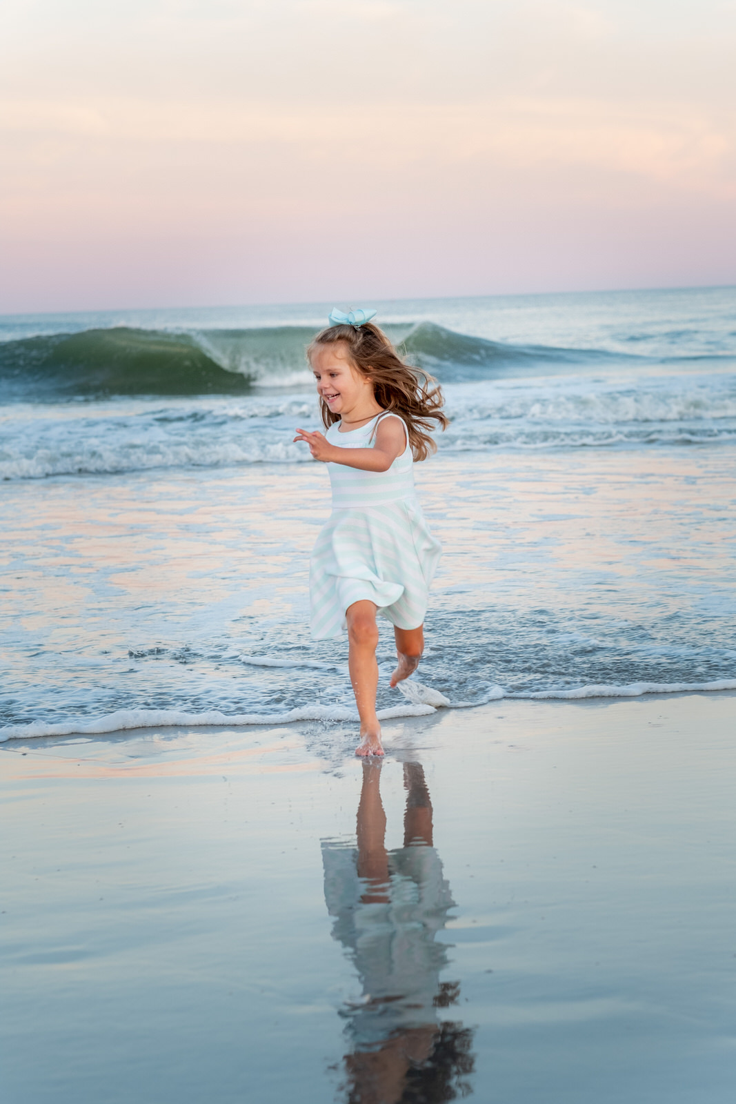 little girl run on beach