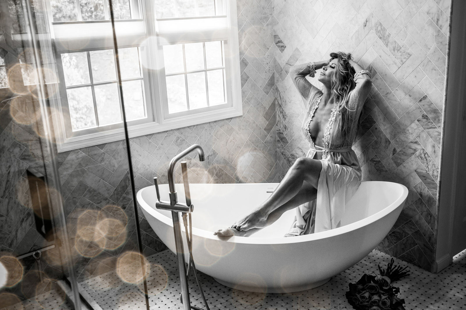 Woman in lingerie in bathtub
