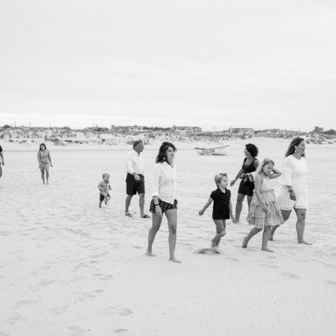 family candid black and white beach