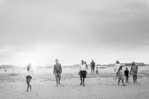 Family candid black and white beach