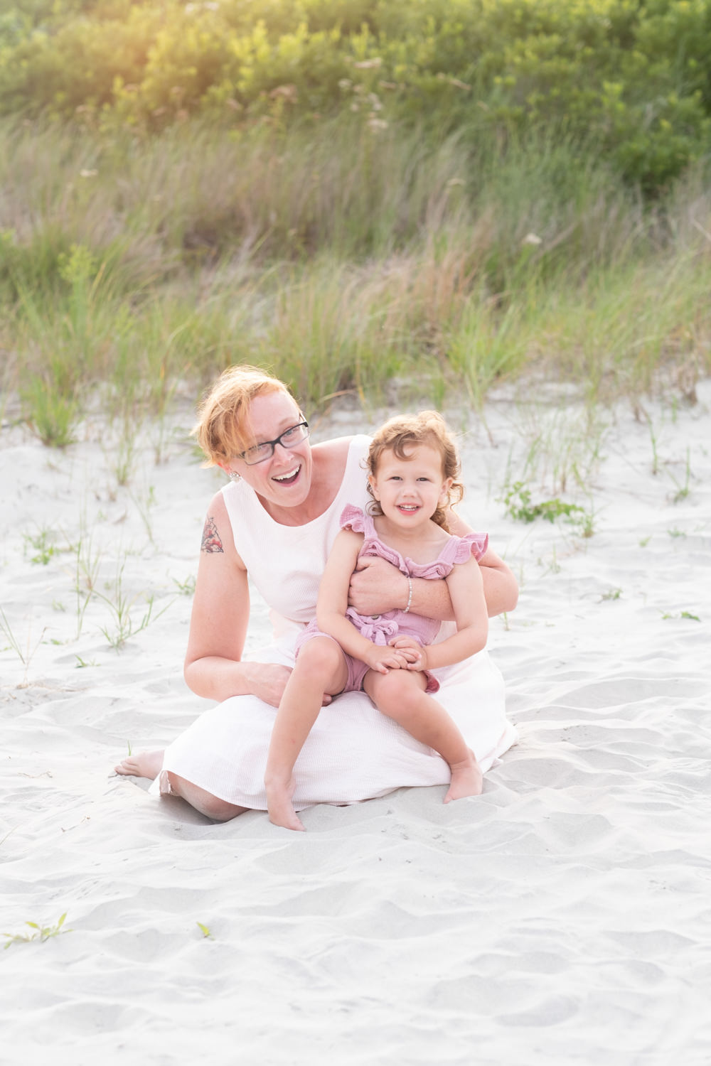 Mom and daughter sitting on beach Wildwood NJ