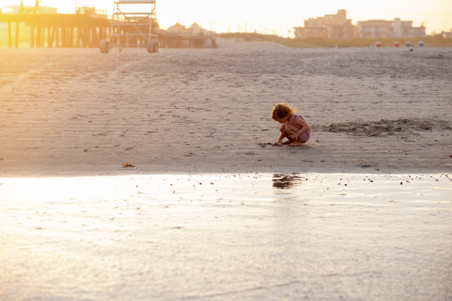 little girl play sunset beach