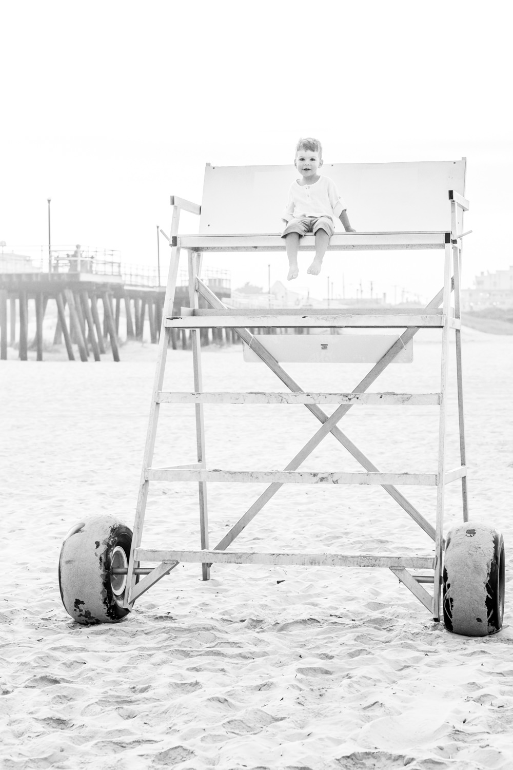 boy lifeguard stand family portraits beach