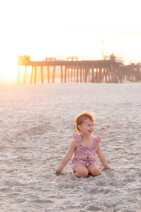 little girl beach sunset