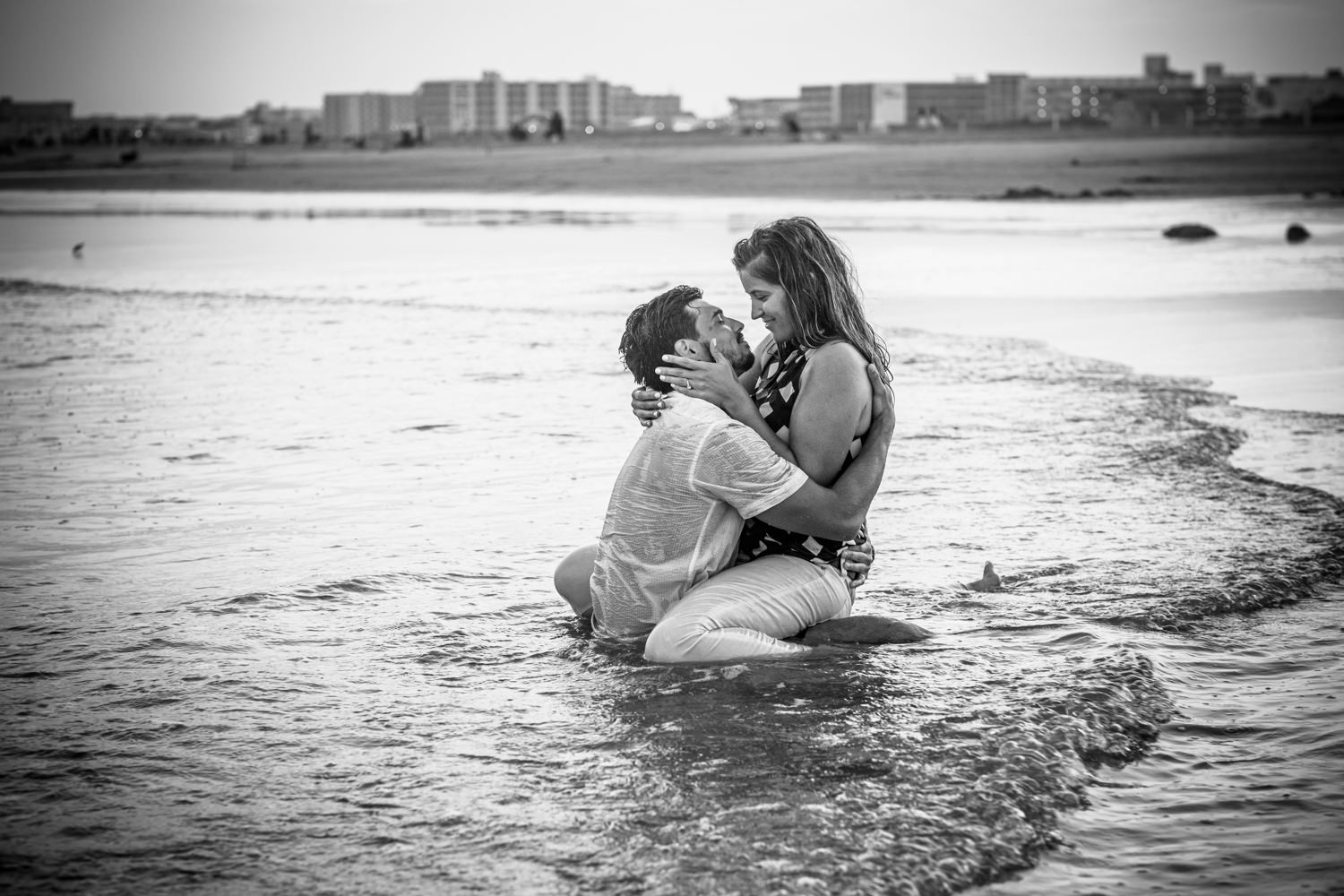 couple in ocean in clothes