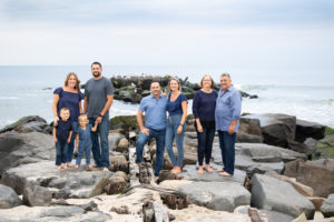 Family beach jetty rock