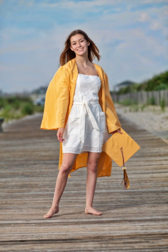 Boardwalk cap and gown senior portrait