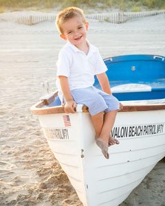 little boy beach boat