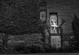 Senior girl ballet dancer on wall