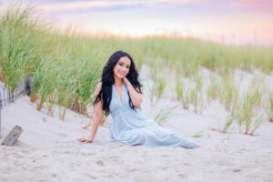 Senior girl in dress on beach