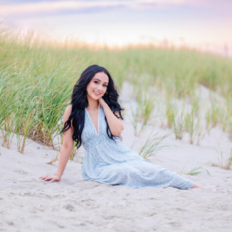 Senior girl in dress on beach