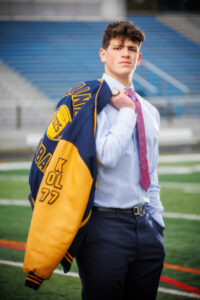 Senior football player in suit