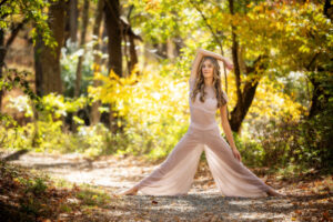 High School senior girl dancer in forest woods