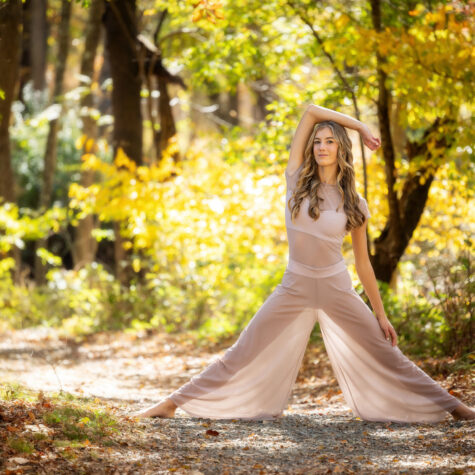High School senior girl dancer in forest woods