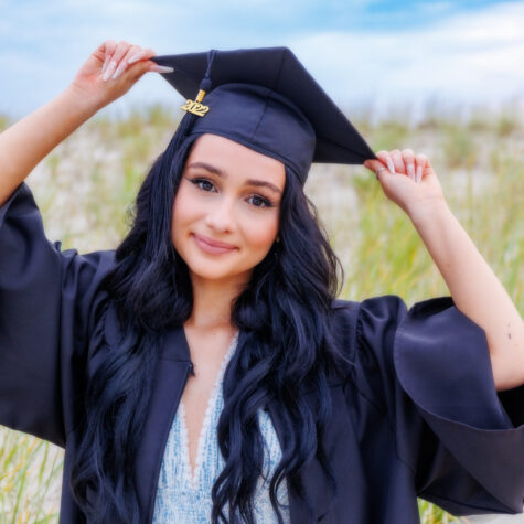 senior cap and gown on beach