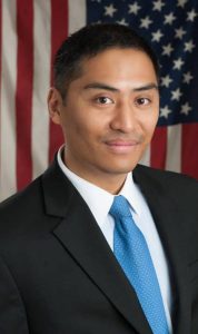 Lawyer in front of american flag headshot
