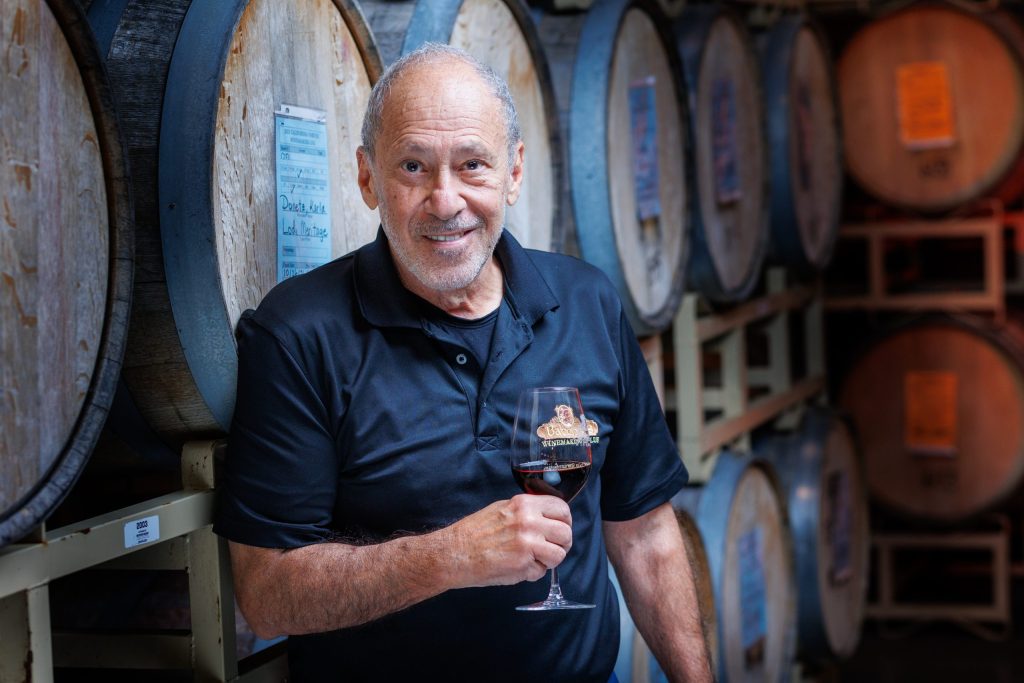 Winemaker vintner headshot by barrel