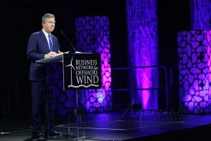 Keynote speaker on stage at podium