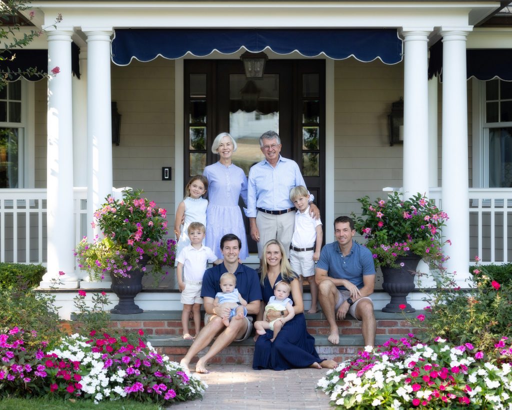 Family on front porch of victorian home