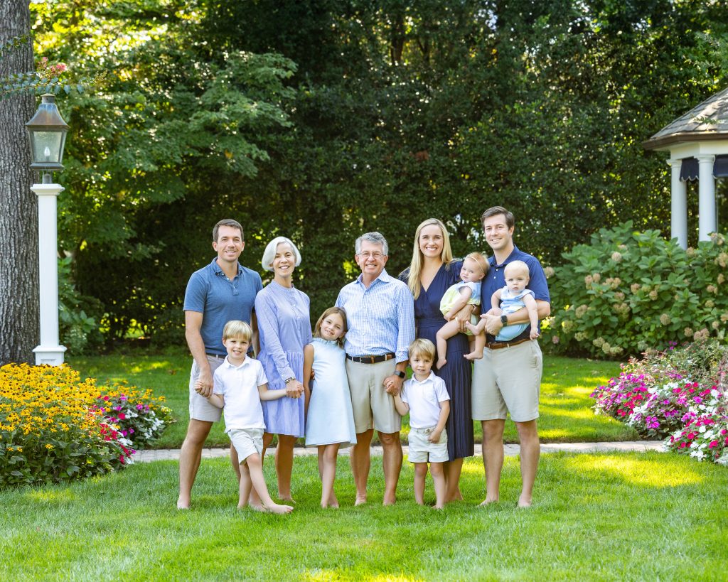 Extended family portrait front home yard