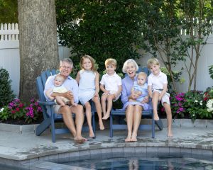 Family photos in backyard by pool