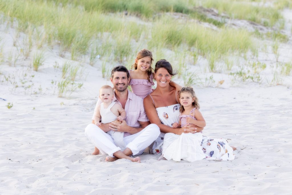 Family sitting on beach