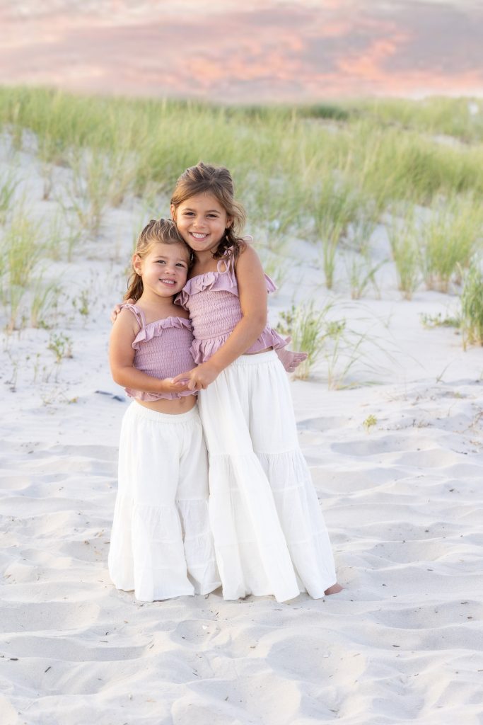 Little sisters family on beach