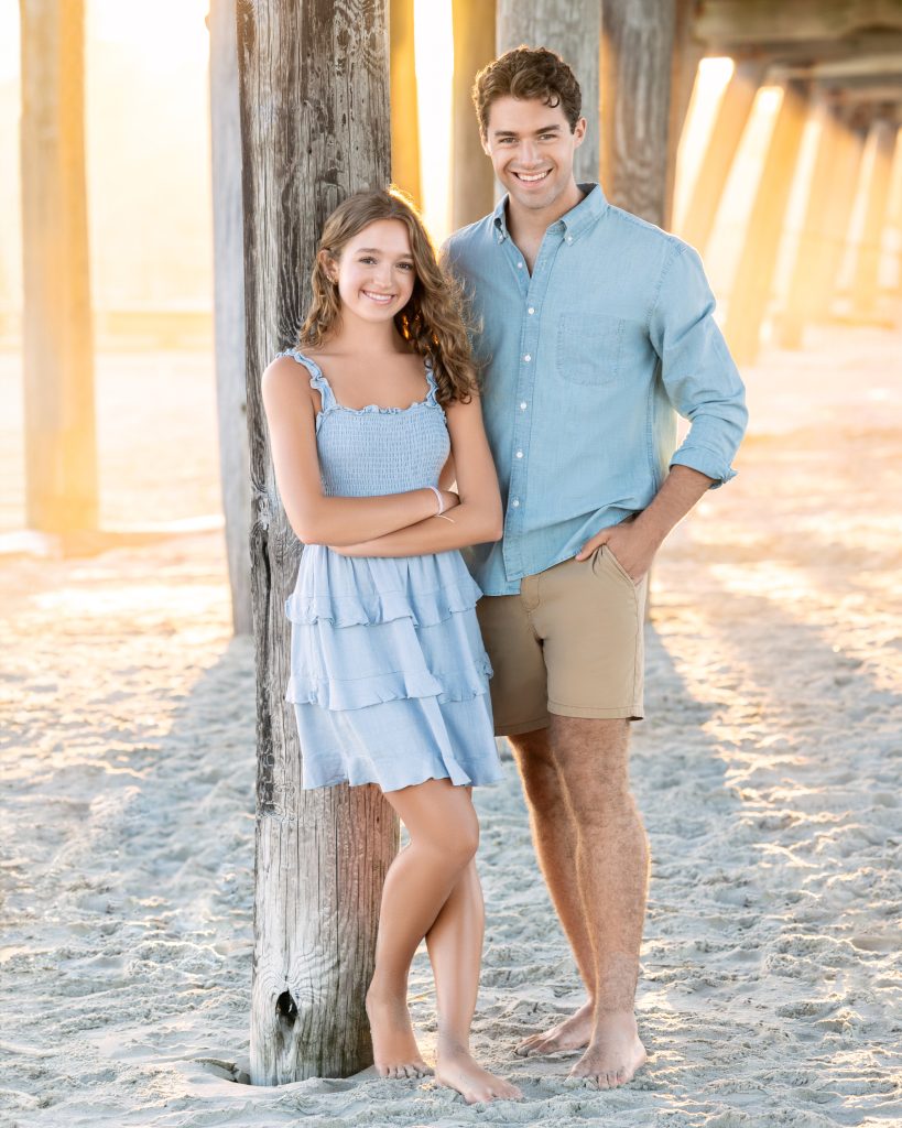 Family under avalon fishing pier 