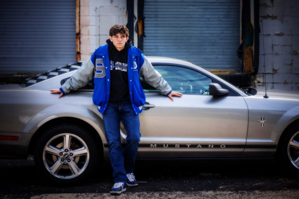 high school senior boy by car