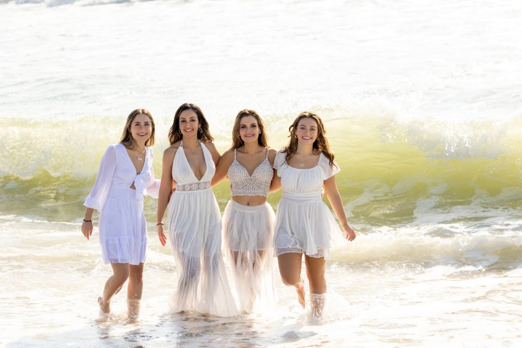 Girls running in water manasquan beach NJ 