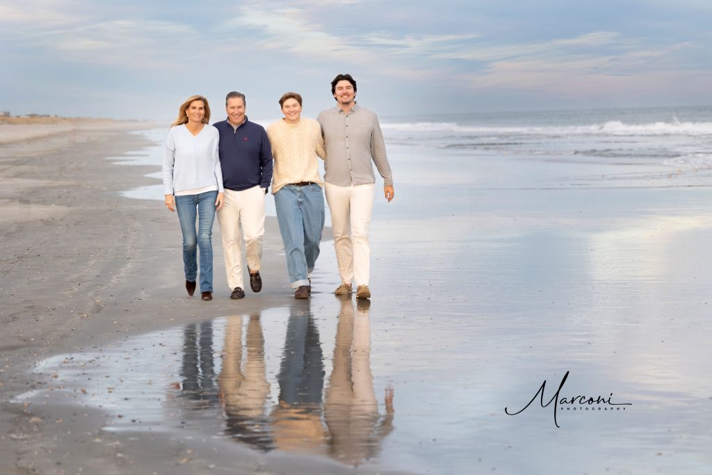 Family walking reflection beach 