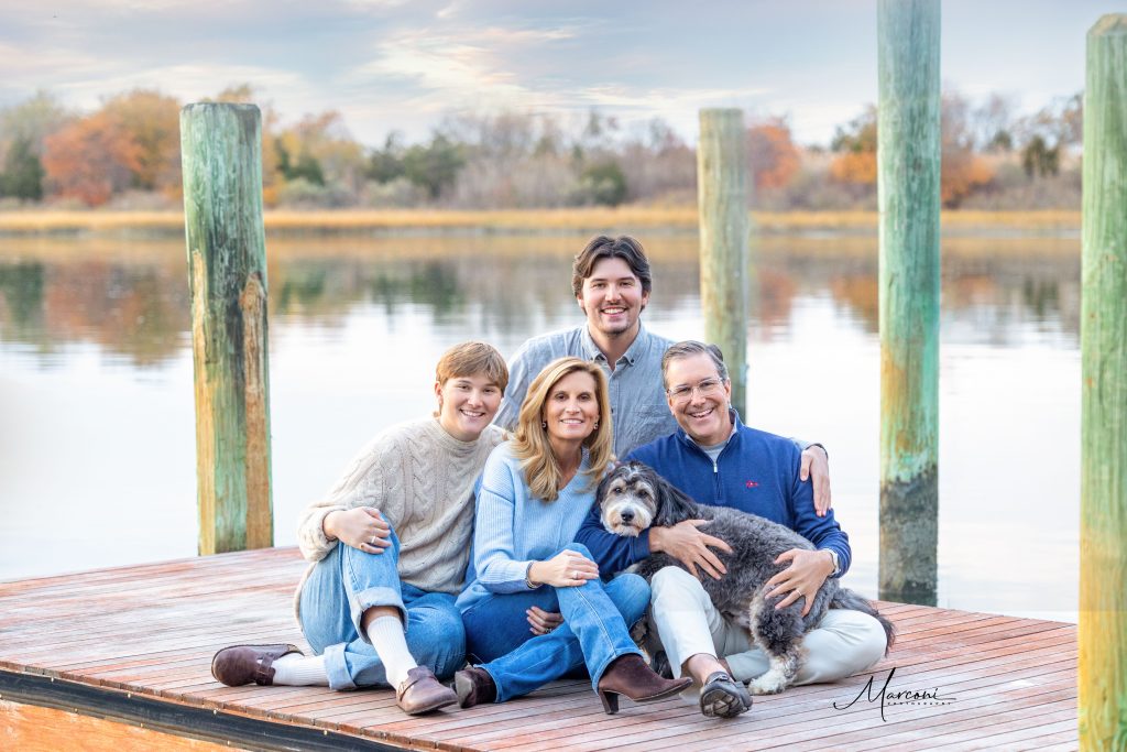 Winter family photo on dock over water