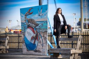 woman standing confident on bench boardwalk beach